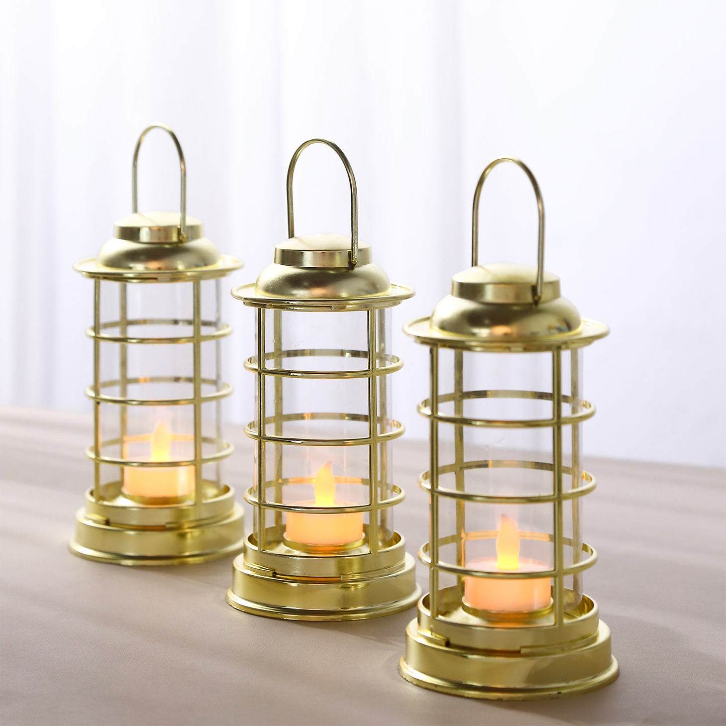 Gold LED mini lantern lamps in a decorative tealight style.