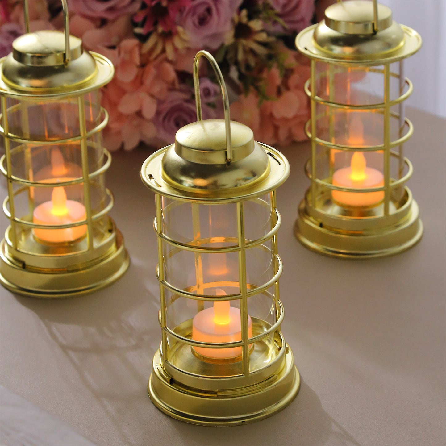 Gold LED mini lantern lamps with flickering tealight candles.