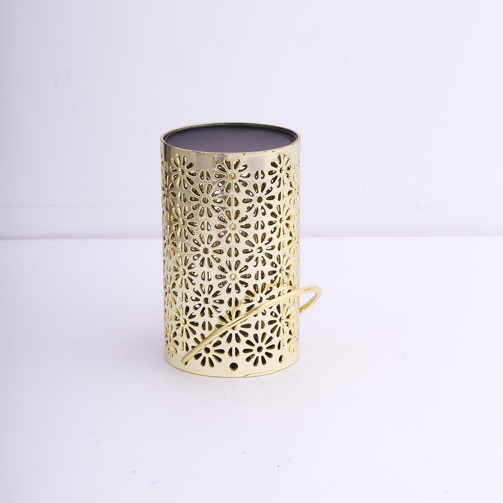 Gold decorative lantern light with flower design, battery operated for hanging.