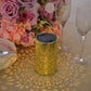 Gold decorative lantern casting floral shadows. Battery operated for garden use.