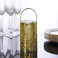 Gold decorative lantern light with flower design, battery operated.