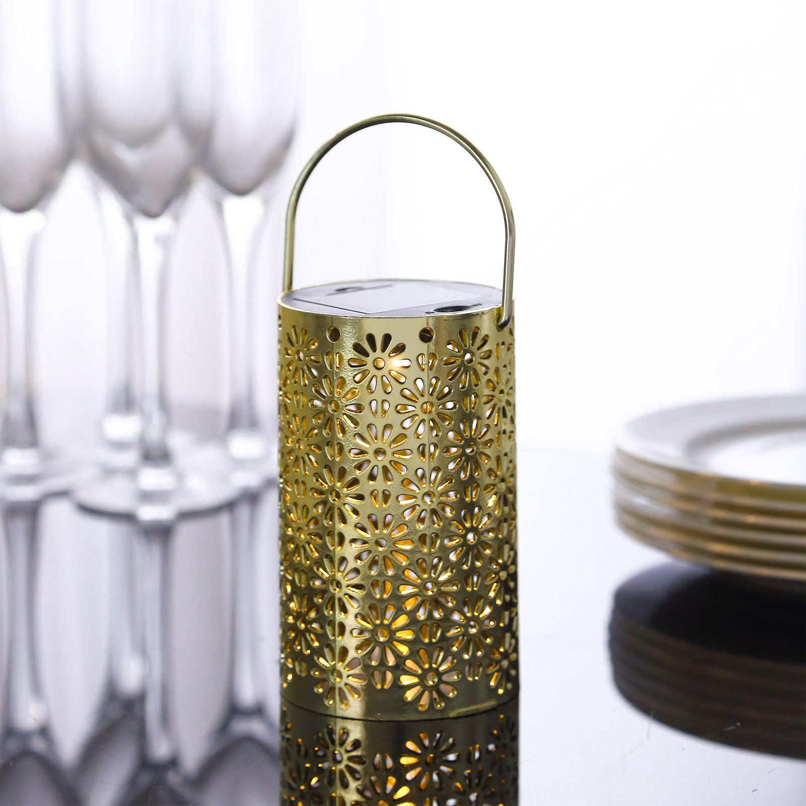 Gold decorative lantern light with flower design, battery operated.