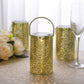 Gold decorative LED lantern with flower design, battery operated for garden use.