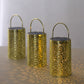 Gold decorative lanterns with flower design, battery operated, perfect for hanging in gardens.