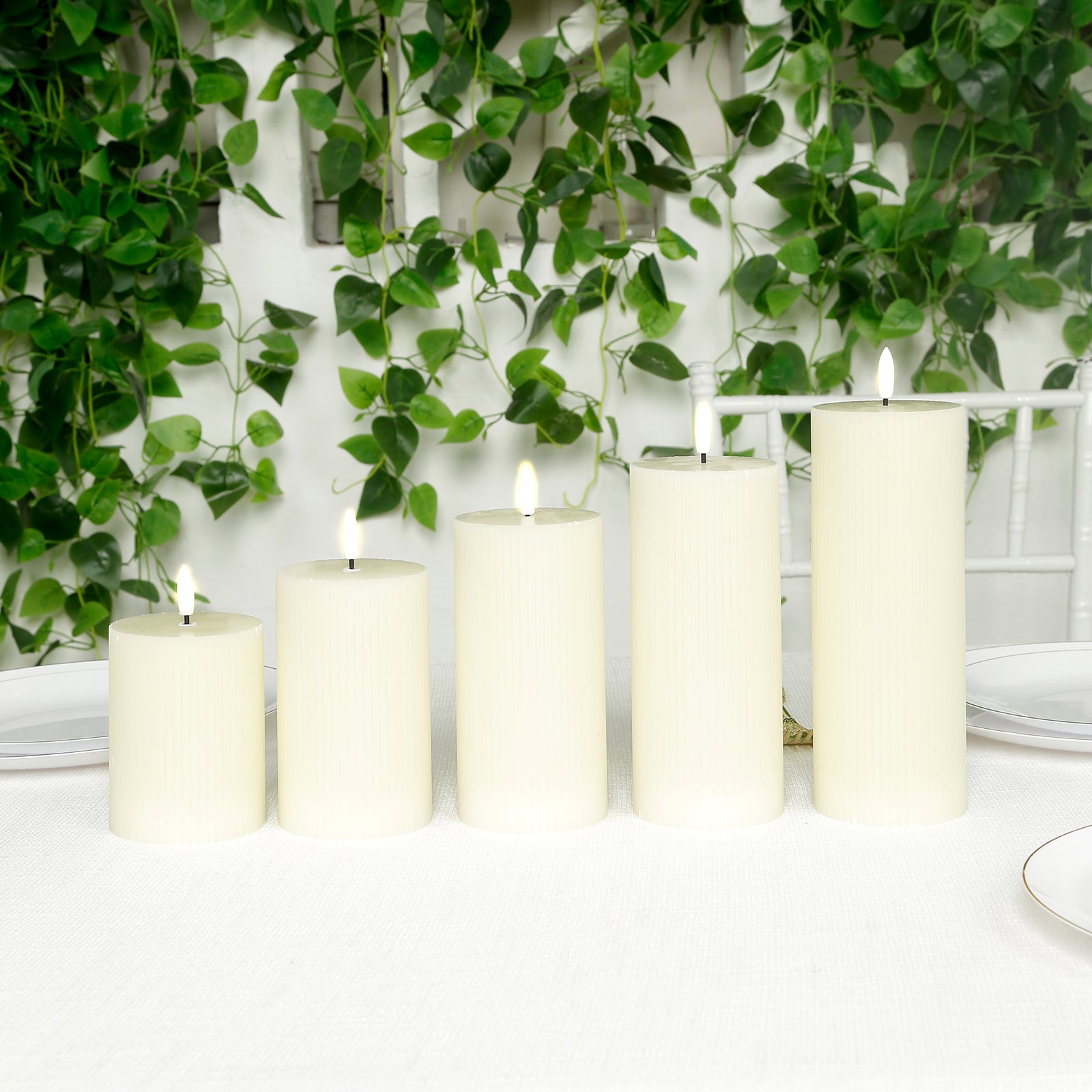 Ivory LED flameless pillar candles set of 5 with ribbed design.