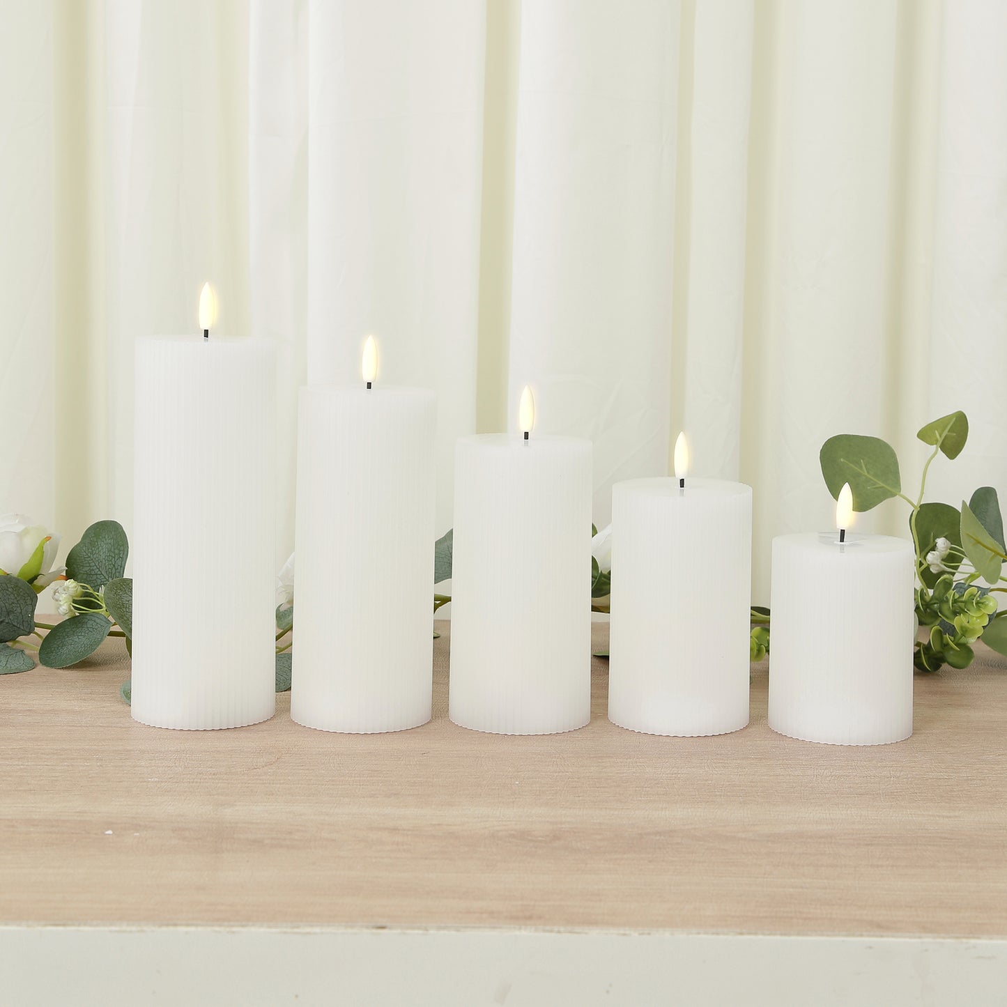 White LED flameless pillar candles, set of 5, ribbed design, warm white flickering light.