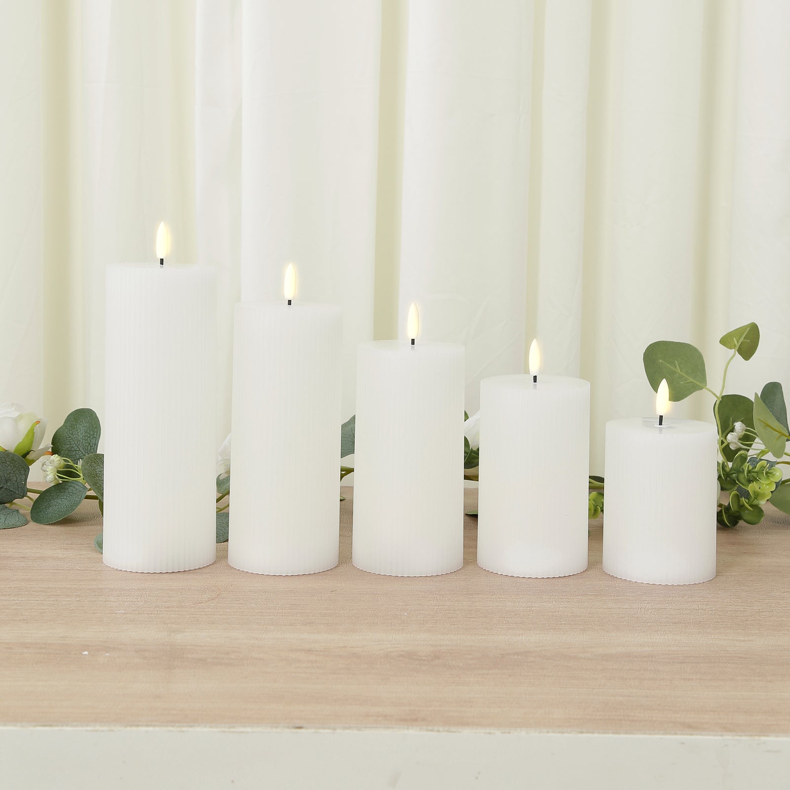 White LED flameless pillar candles, set of 5, ribbed design, warm white flickering light.