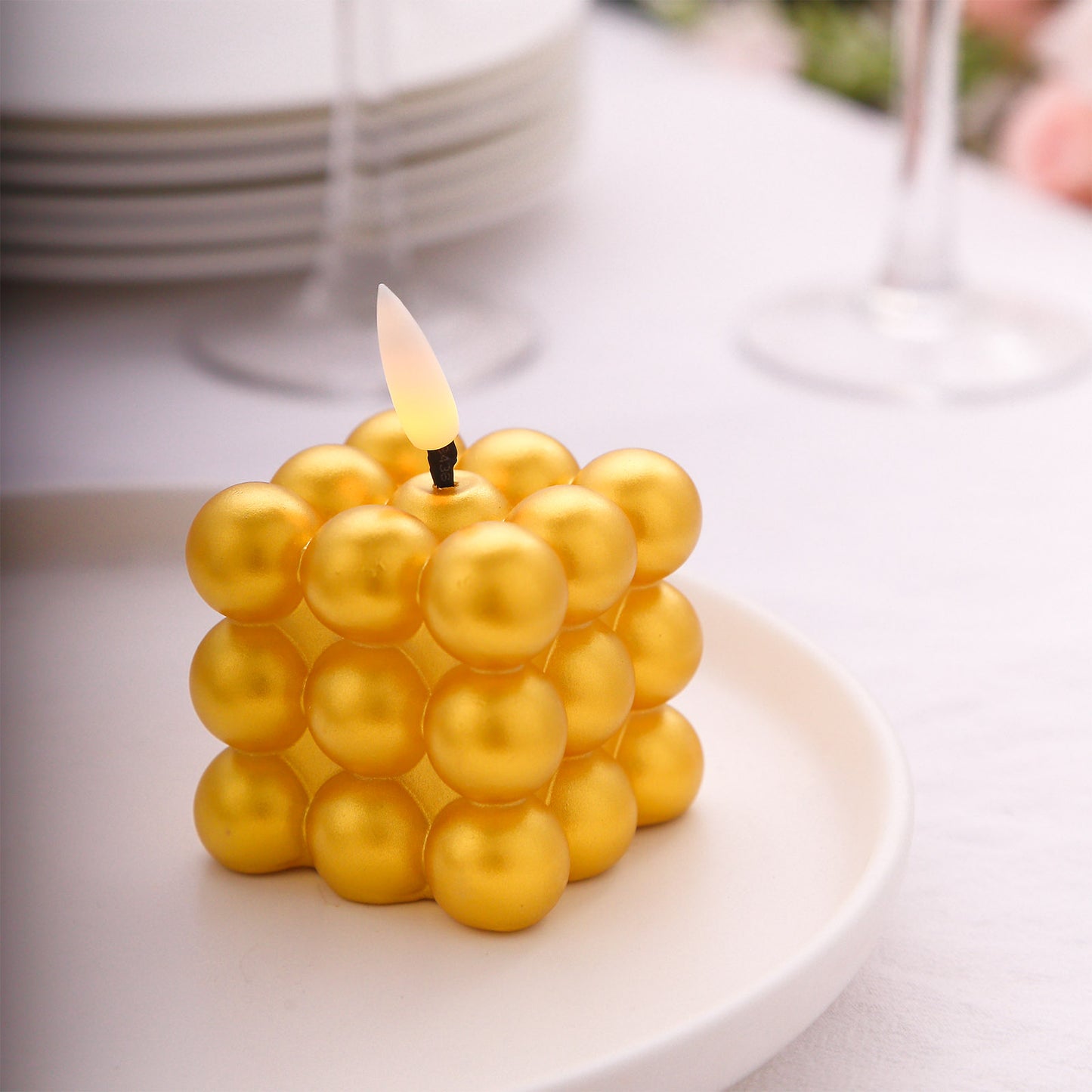 Metallic gold LED mini bubble candle, flameless and battery operated.