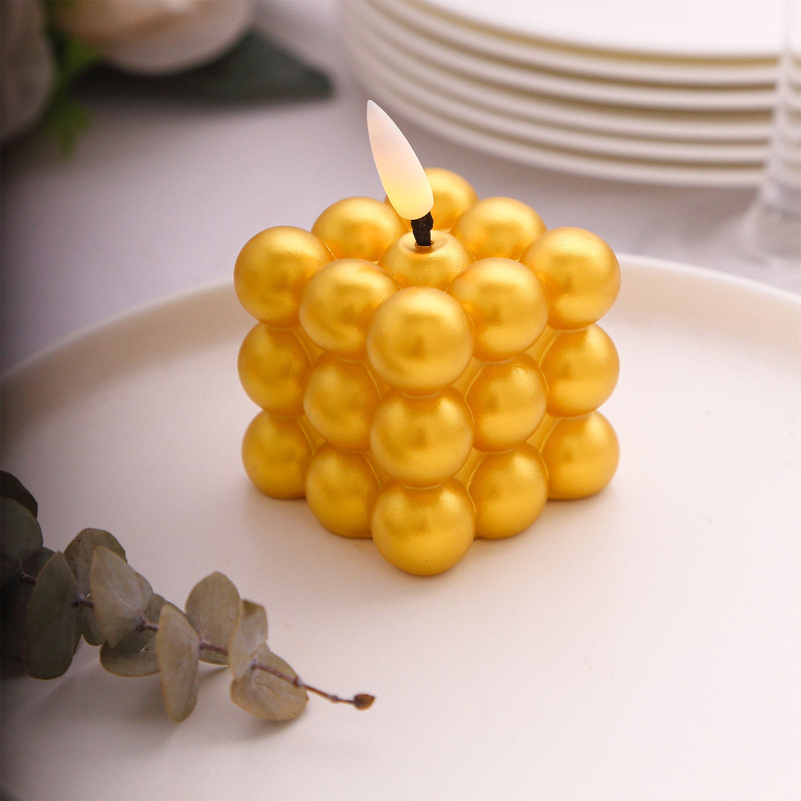 Metallic gold LED mini bubble candle, flameless and battery operated.