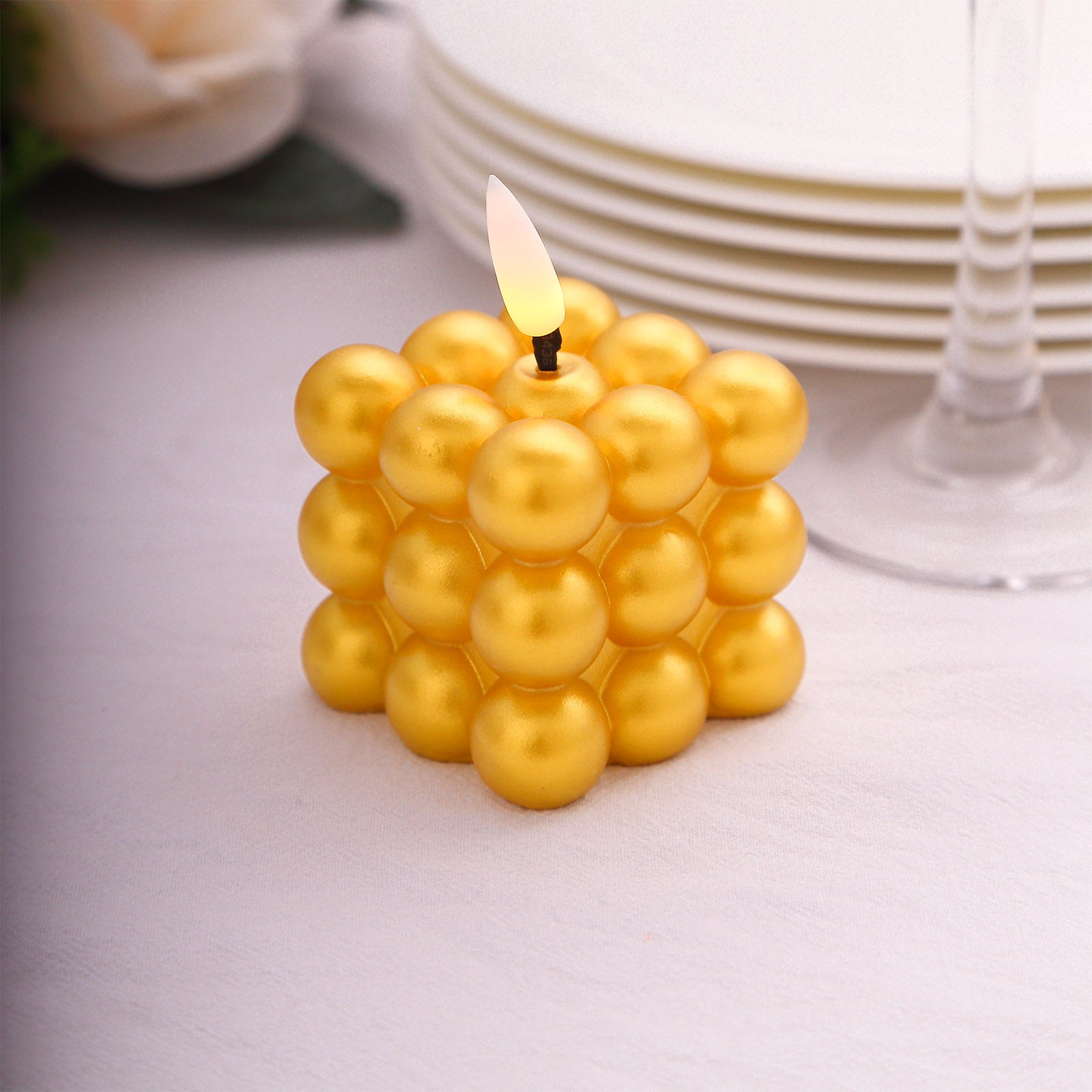 Metallic gold LED mini bubble candle, flameless and battery operated.