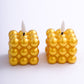 Metallic gold LED mini bubble candles, flameless and battery operated.