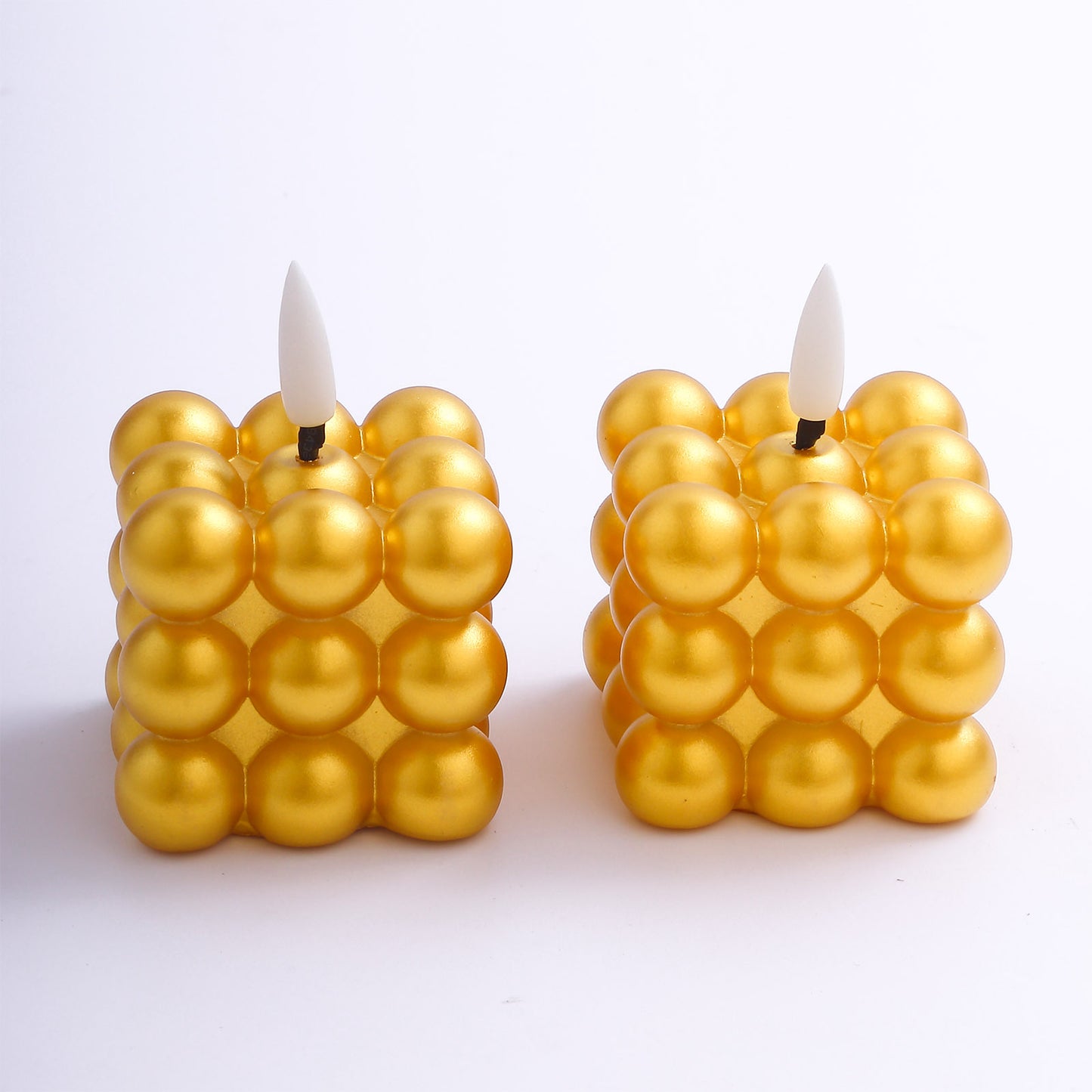 Metallic gold LED mini bubble candles, flameless and battery operated.