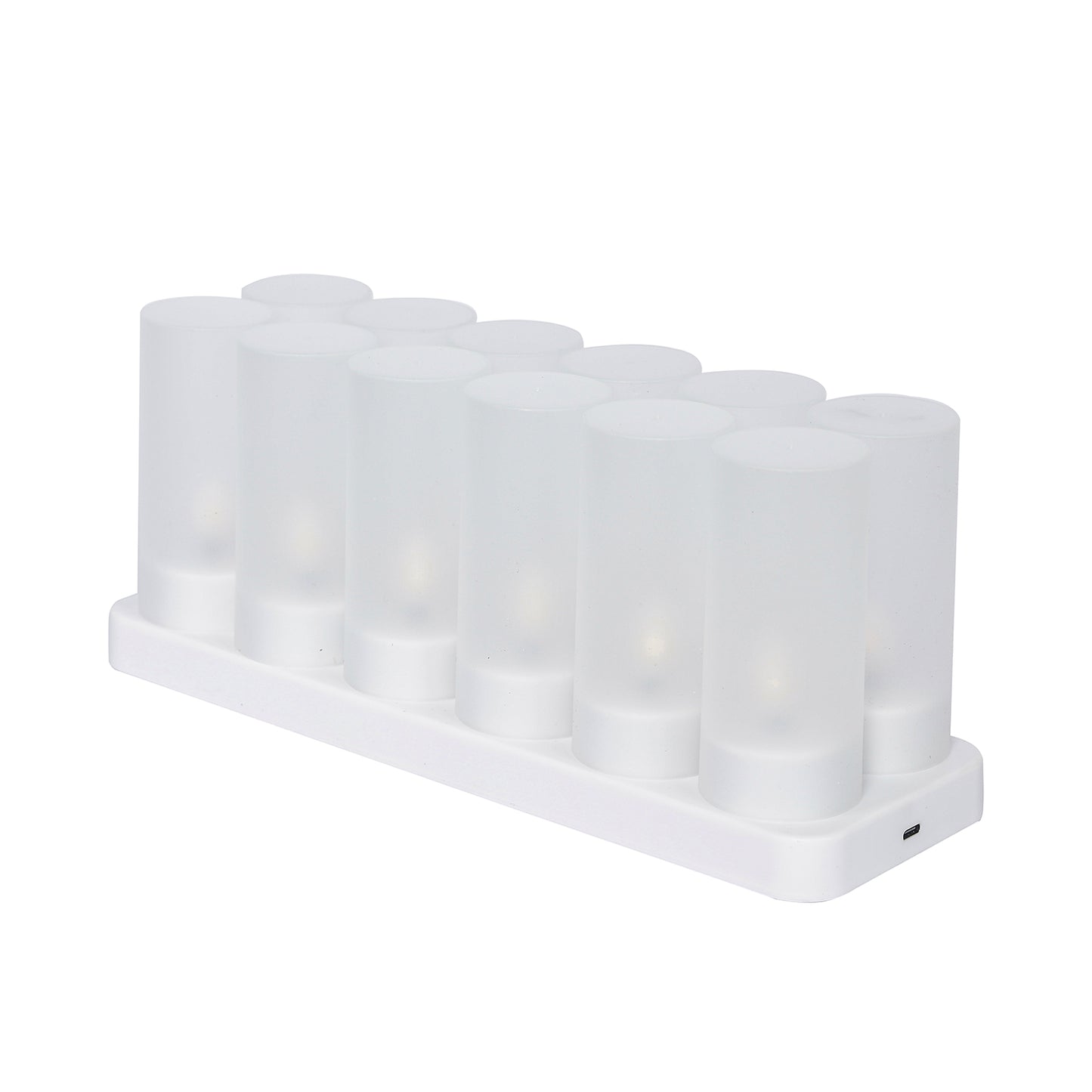 White flameless LED tea light candles with frosted shades and charging station.
