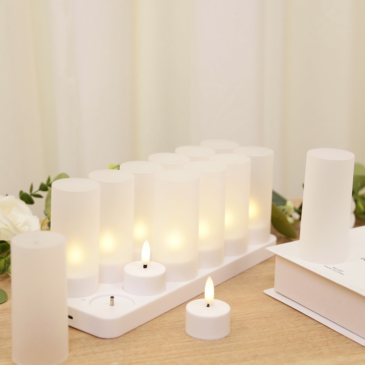 White flameless LED candles with a warm white flickering effect.