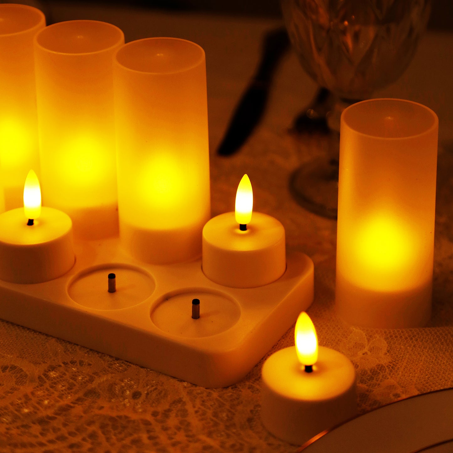 Warm white flameless LED tea light candles on a table.