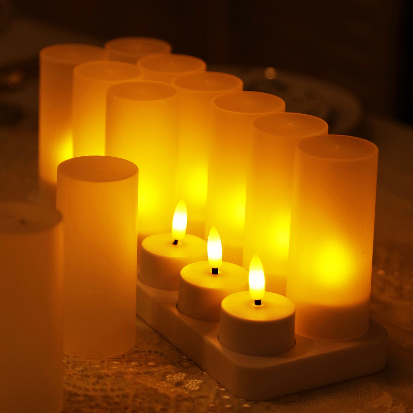 White flameless LED tea light candles with warm white flickering effect.