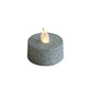 Silver glittered LED tealight candle, flameless and battery-operated.