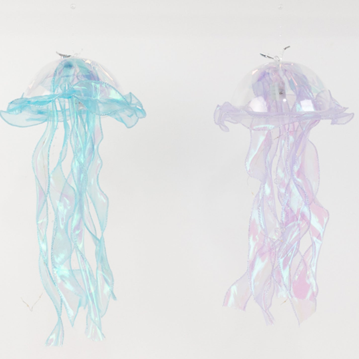 Blue and purple jellyfish lantern lights with organza ribbons.
