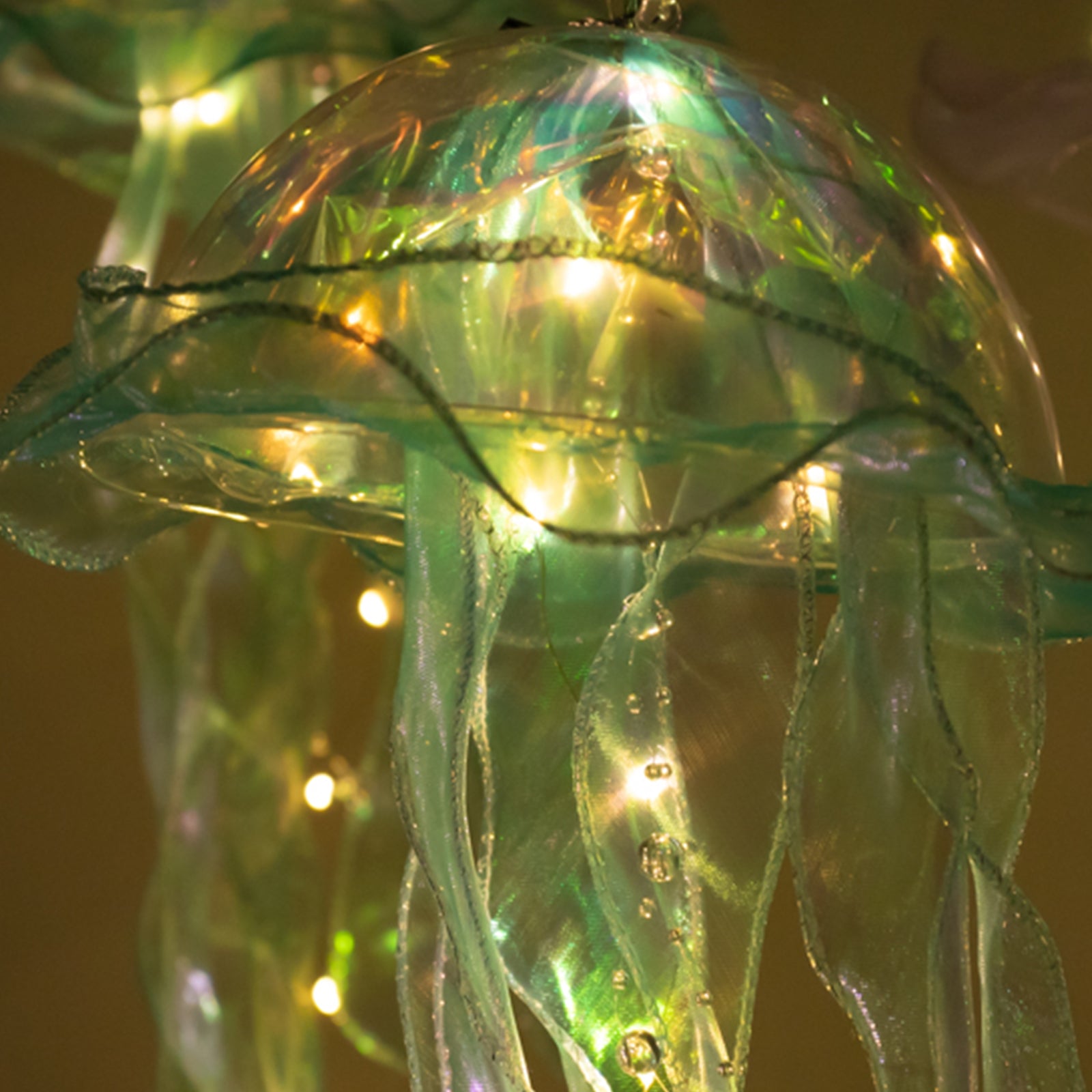 Blue purple jellyfish lamp with LED lights for mermaid theme decor.