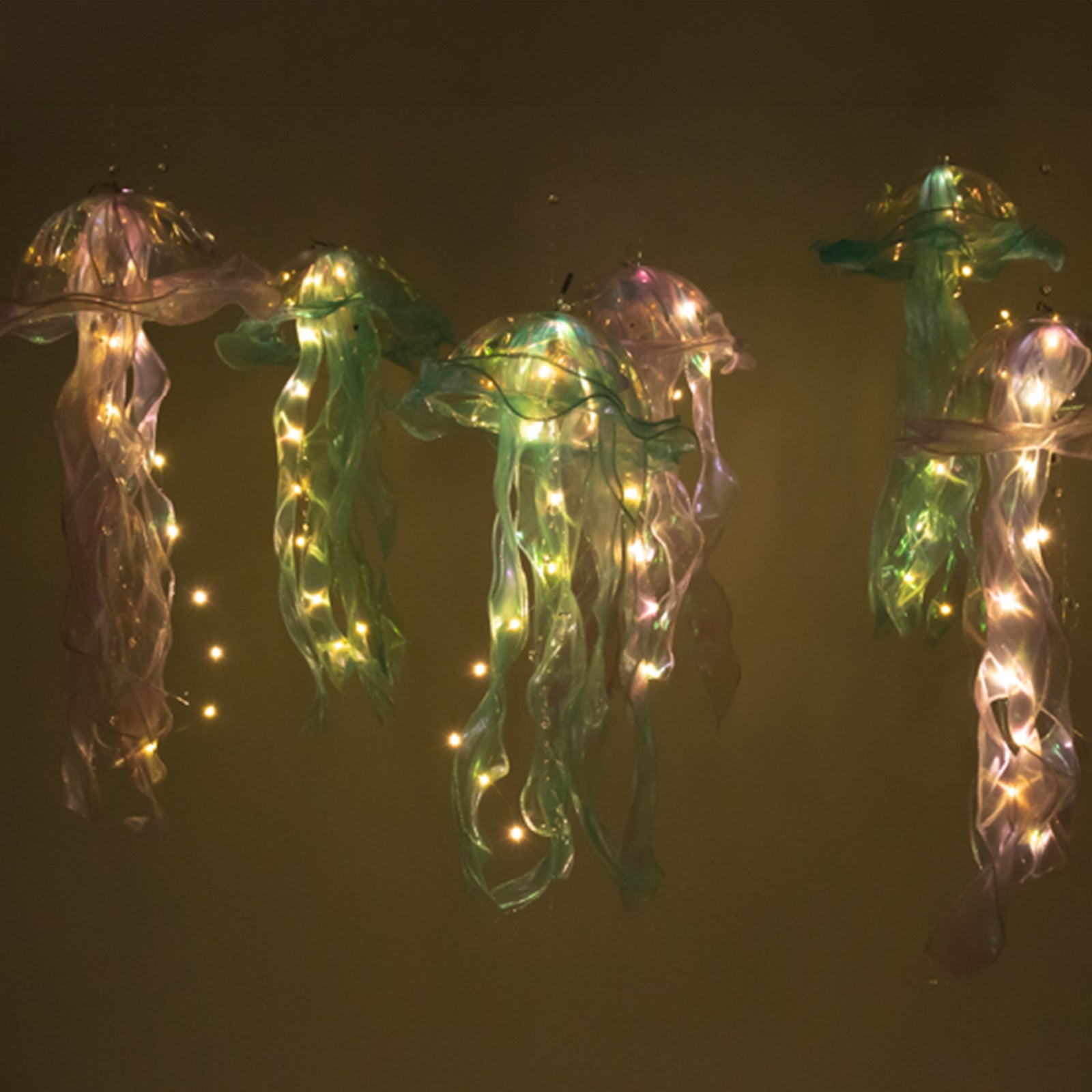 Blue purple jellyfish lanterns with LED lights for mermaid-themed decor.