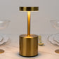 Gold metal LED table lamp with a modern minimalist design.