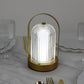 Gold LED table lamp with ribbed acrylic shade and touch control.