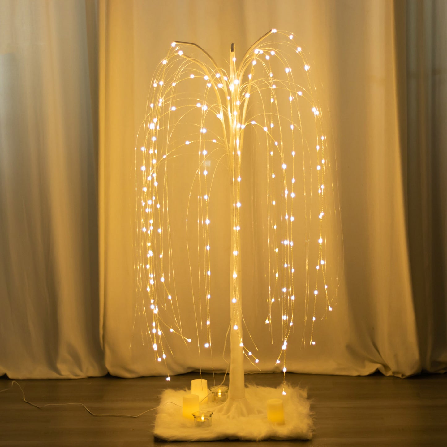 Warm white LED artificial weeping willow tree centerpiece with fairy lights.