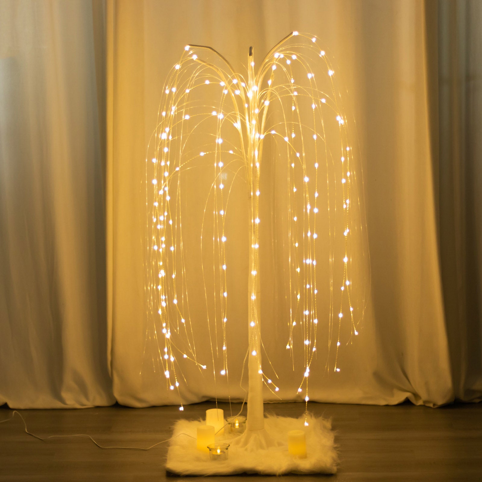 Warm white LED artificial weeping willow tree centerpiece with fairy lights.