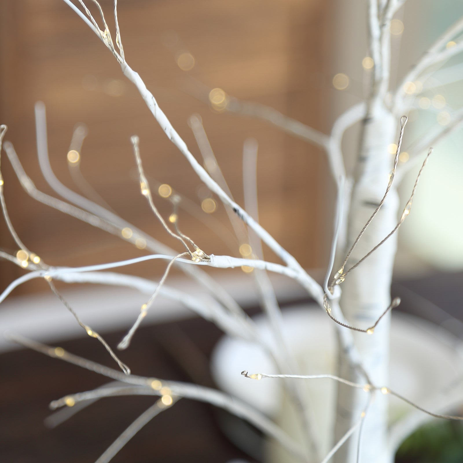 2ft white artificial LED birch tree lamp with warm white lights.