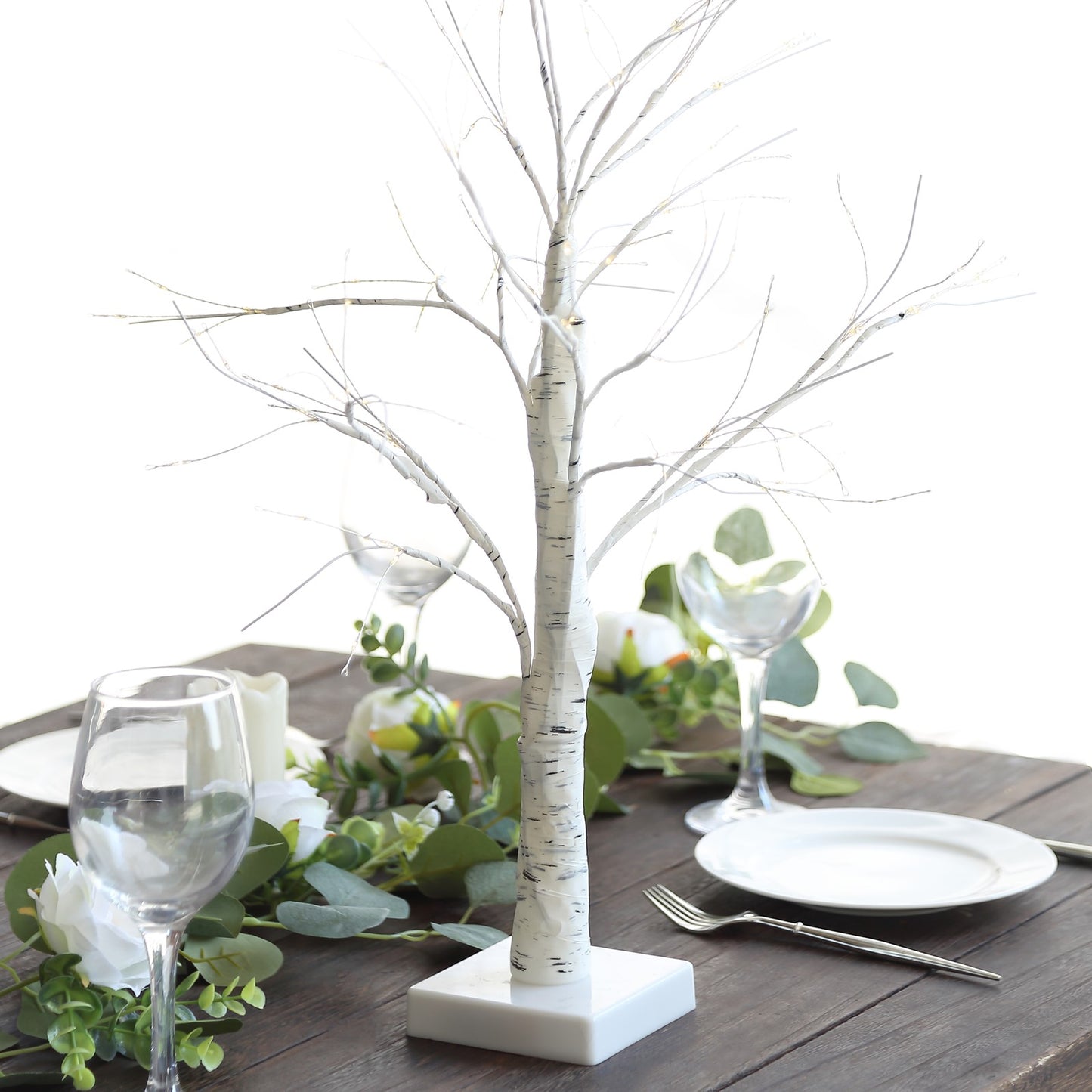 White artificial LED birch tree lamp centerpiece with warm white lights.