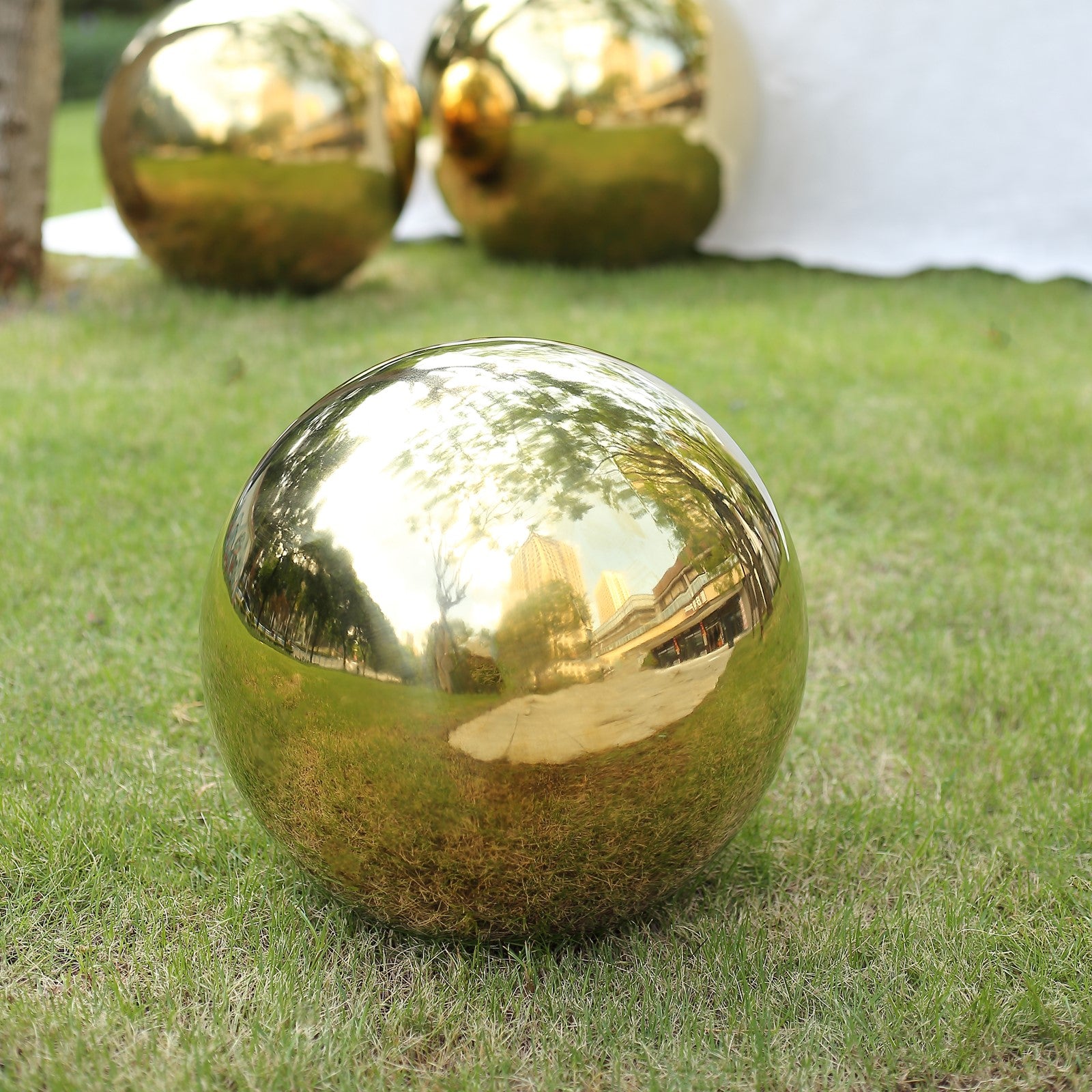 20" Gold Reflective Garden Globe Sphere in Grass