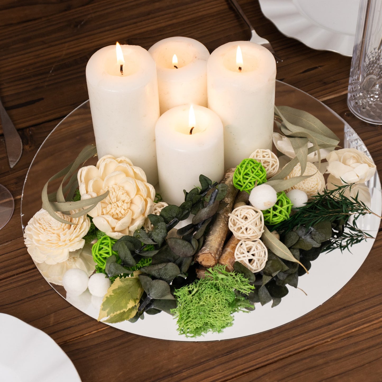 Natural dried assorted potpourri in green and cream with candles.