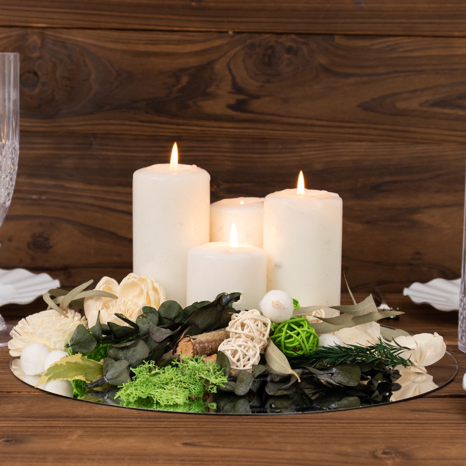 Natural dried assorted potpourri bowl with vanilla fragrance and white candles.