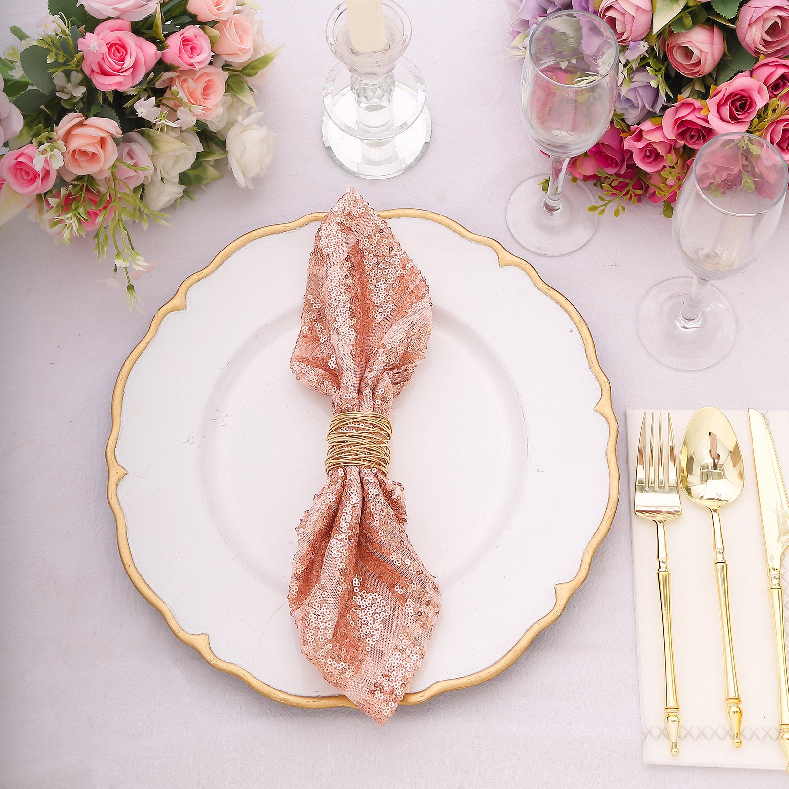 Blush geometric diamond glitz sequin cloth napkin on a decorative plate.