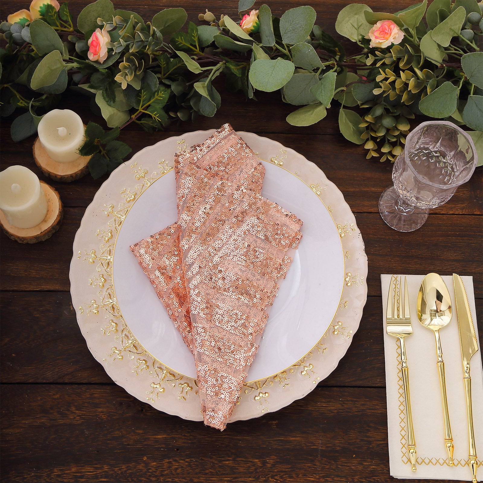 Blush sequin cloth napkins on a decorative dinner table setting.