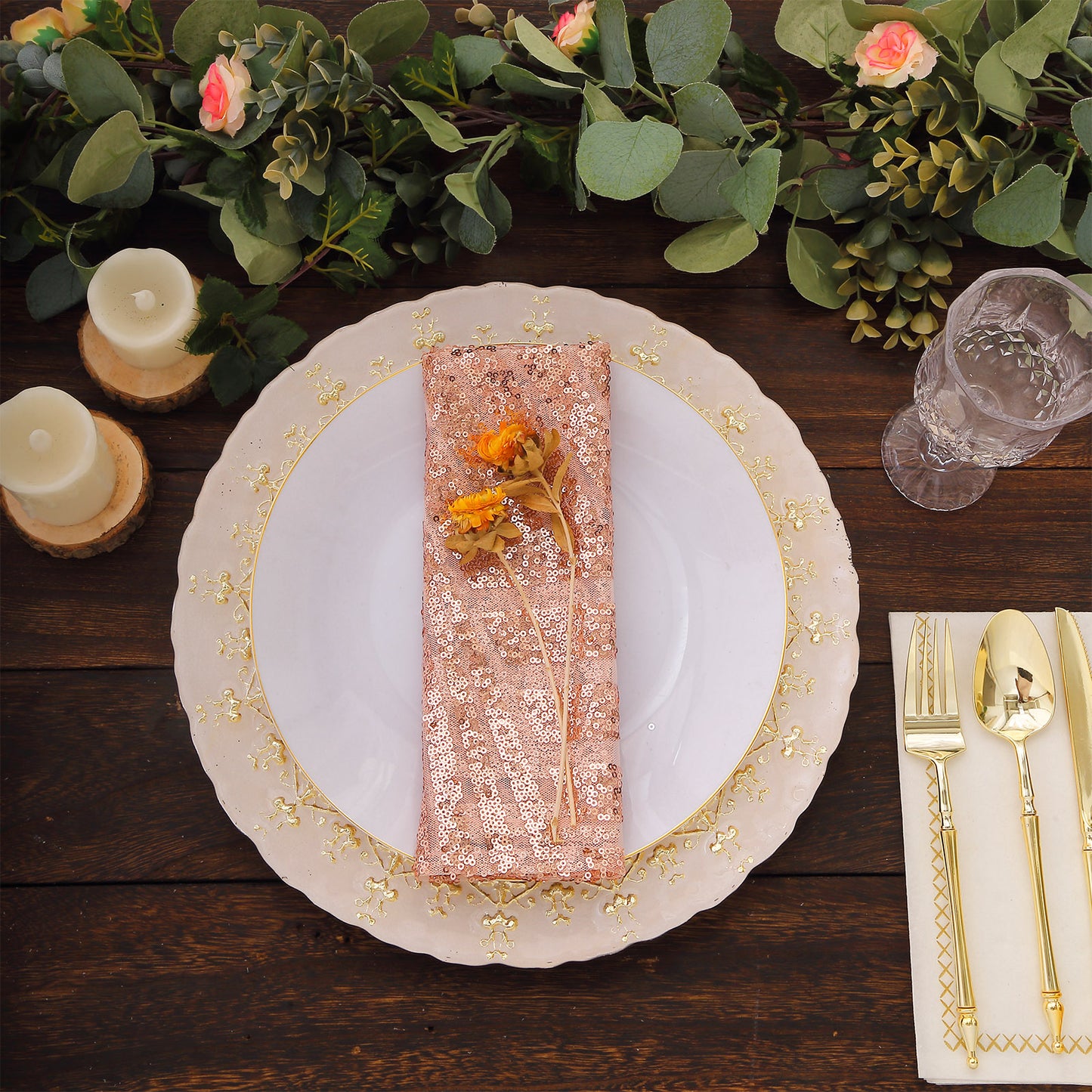 Blush sequin cloth napkin on an elegant dinner plate setting.