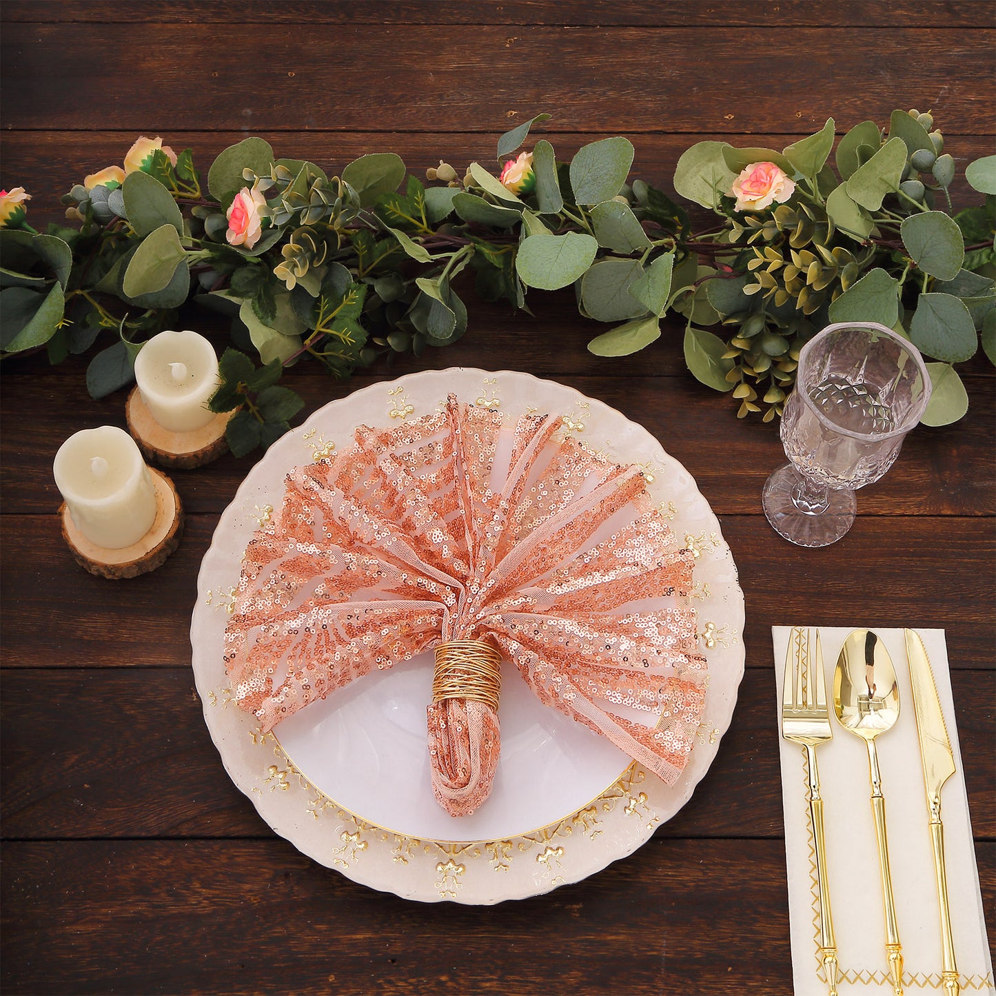 Blush geometric diamond glitz sequin cloth napkins on a decorative table setting.