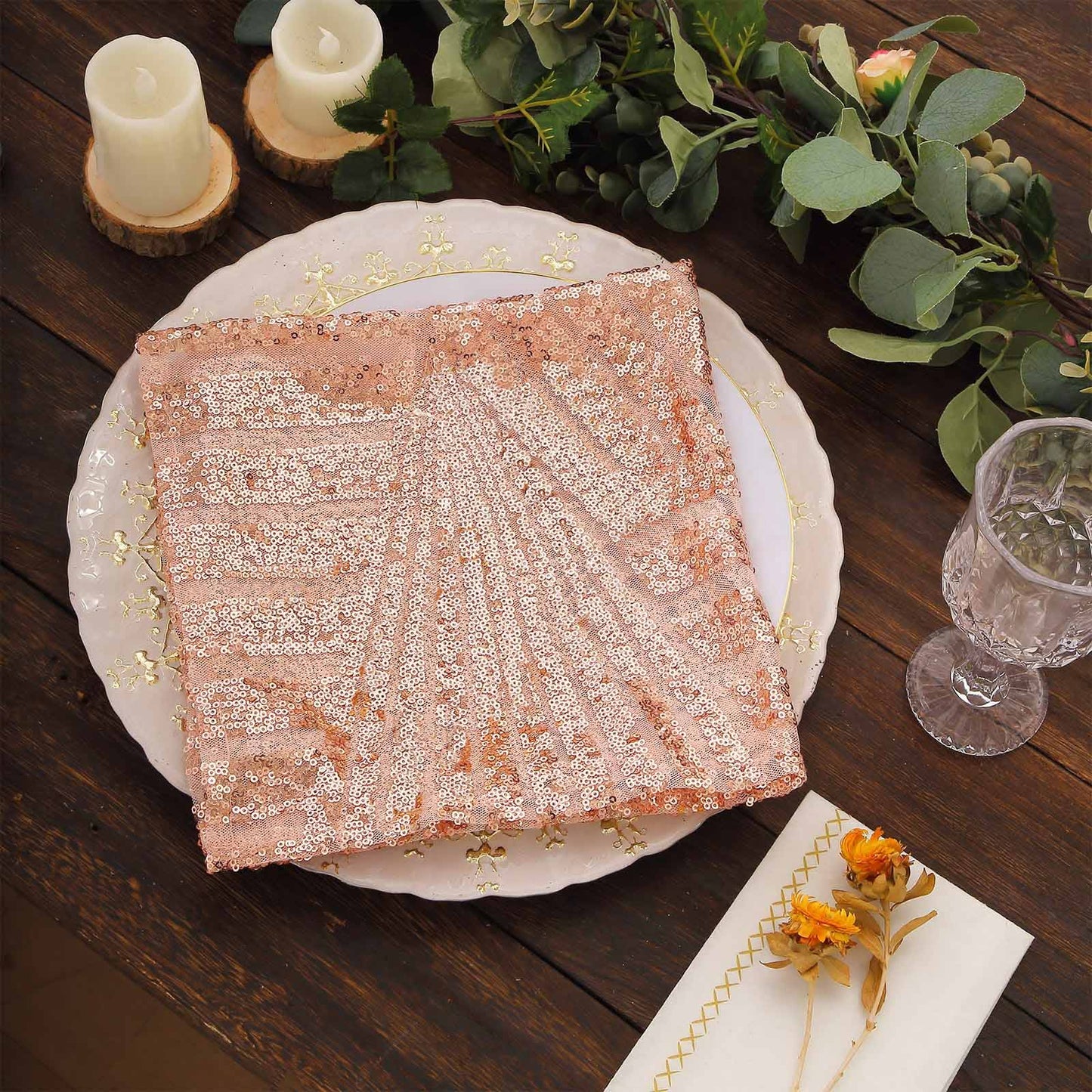 Blush geometric diamond glitz sequin napkin on a decorative table setting.