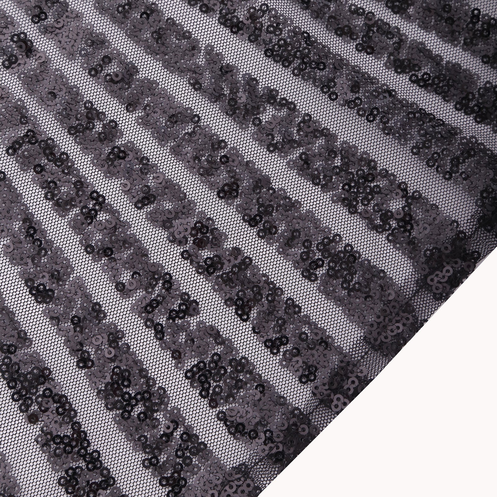 Black geometric diamond glitz sequin cloth napkins on a textured background.
