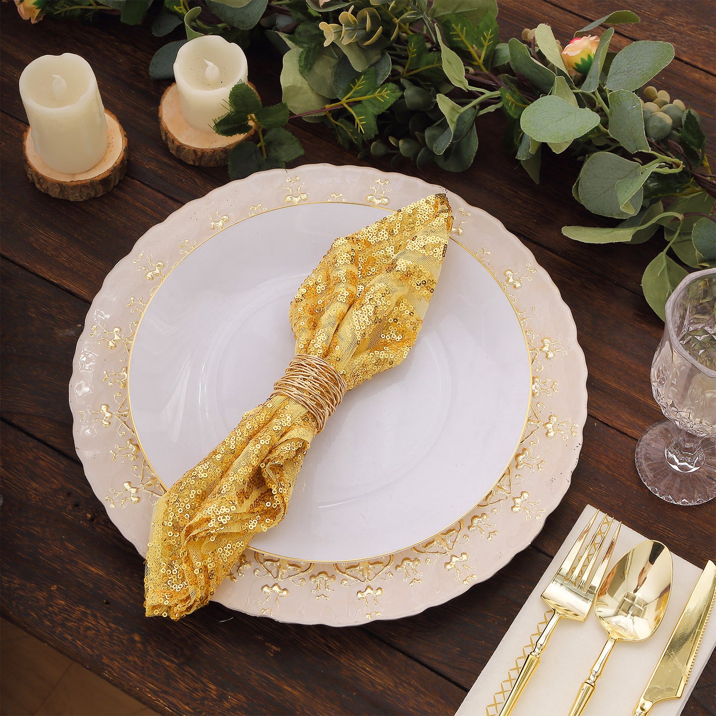 Gold sequin cloth napkin with geometric diamond design on a decorative table setting.