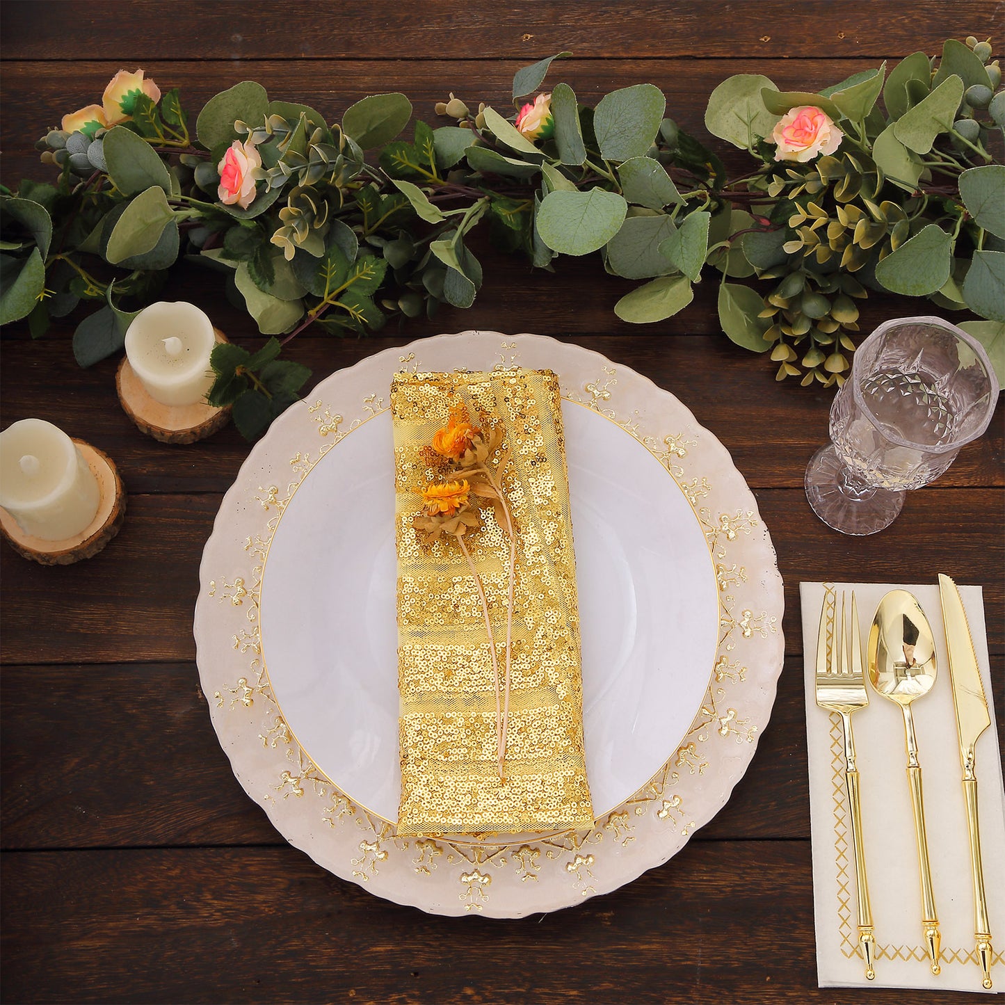 Gold geometric sequin cloth napkins on a decorative dinner table setting.