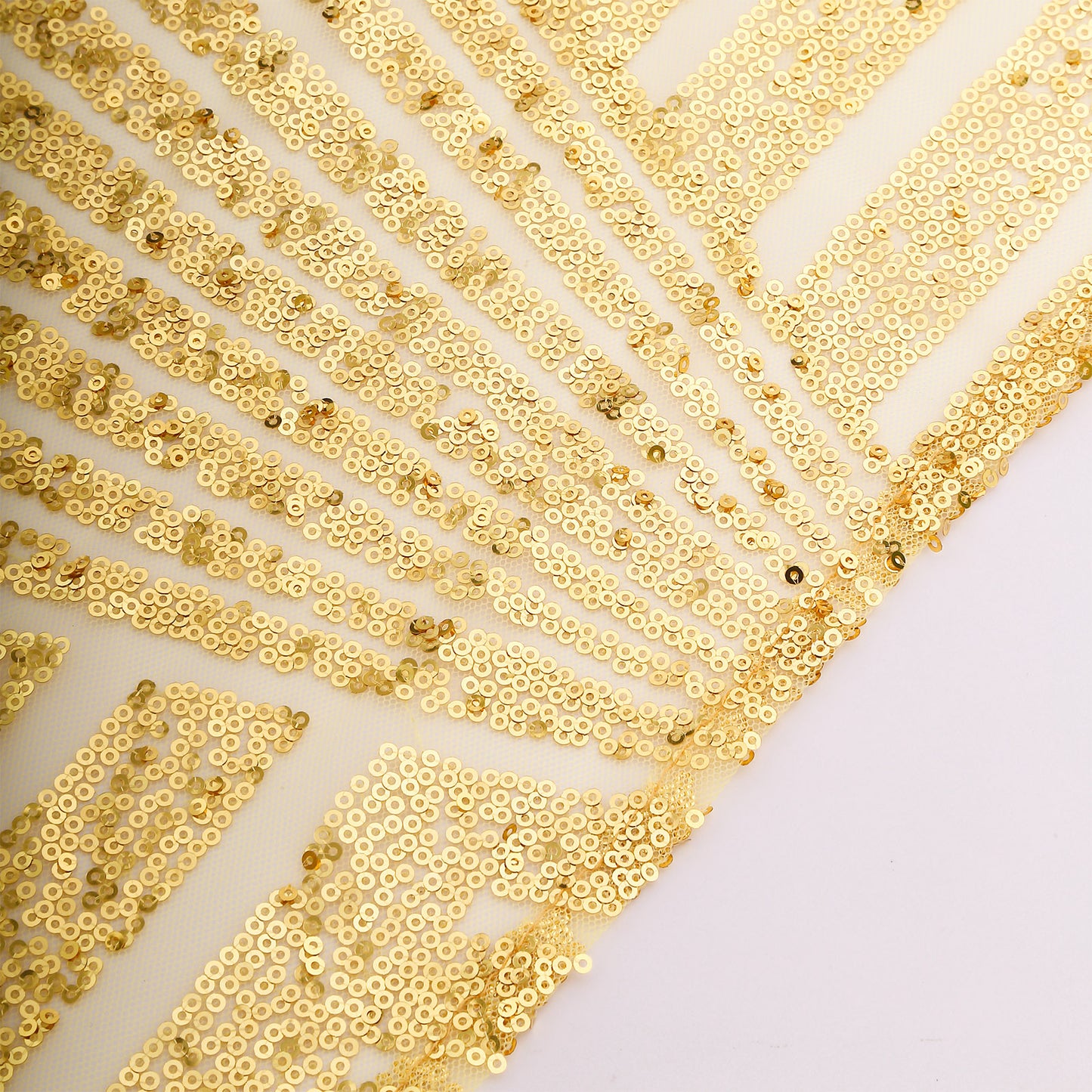 Gold geometric sequin cloth napkins for elegant dining decor.