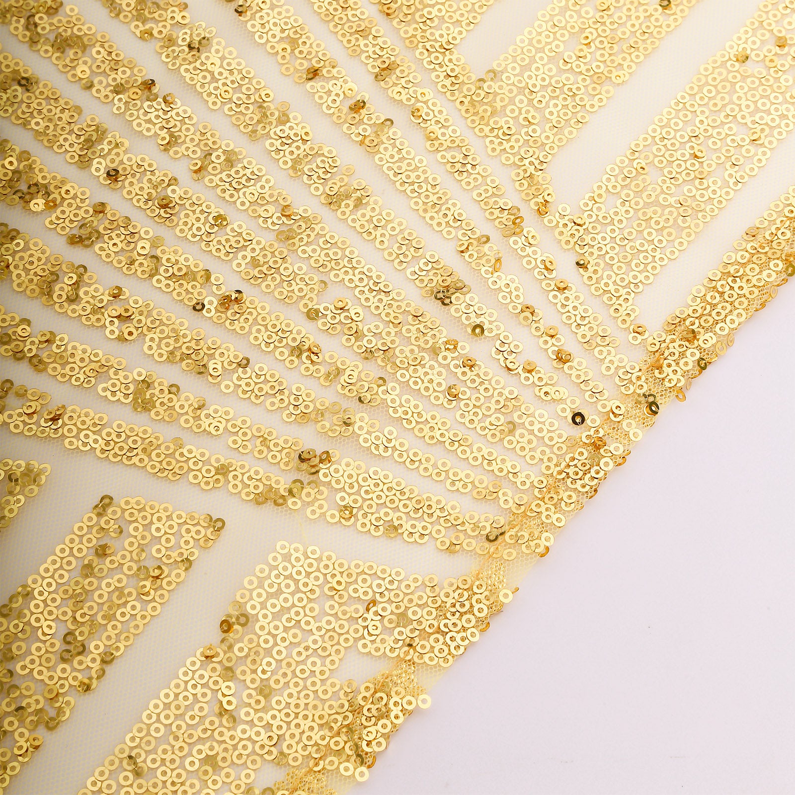 Gold geometric sequin cloth napkins for elegant dining decor.