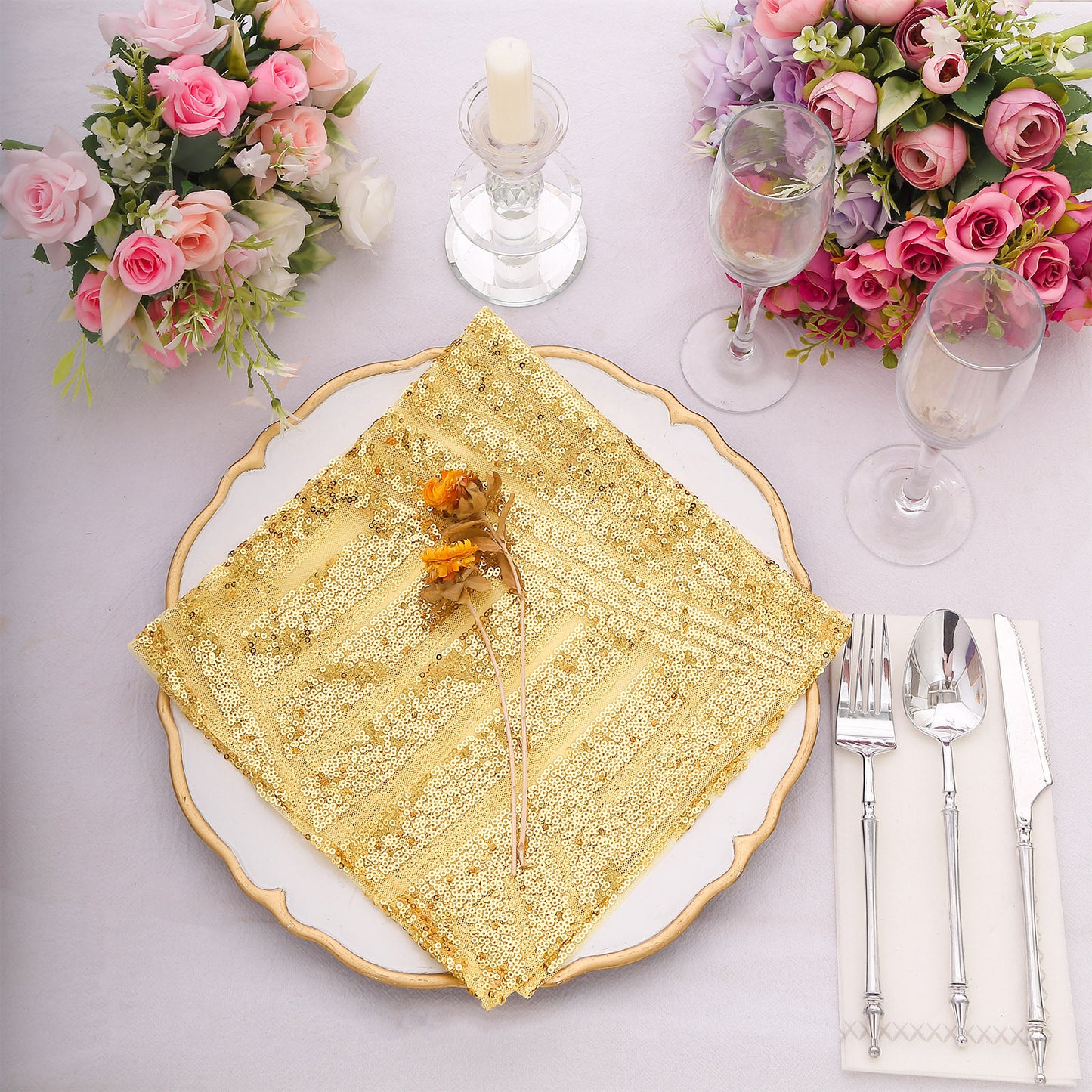Gold geometric sequin cloth napkin on a decorative table setting.