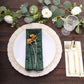 Emerald green geometric diamond glitz sequin cloth napkin on elegant table setting.