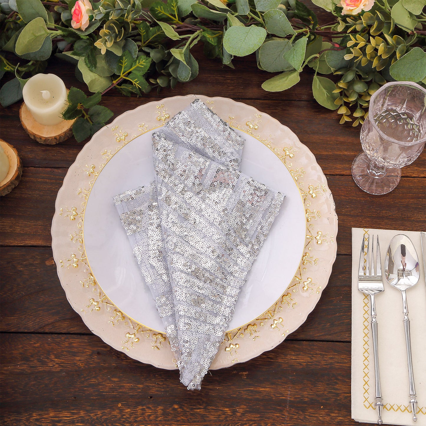 Silver geometric diamond glitz sequin napkins on a decorative plate.