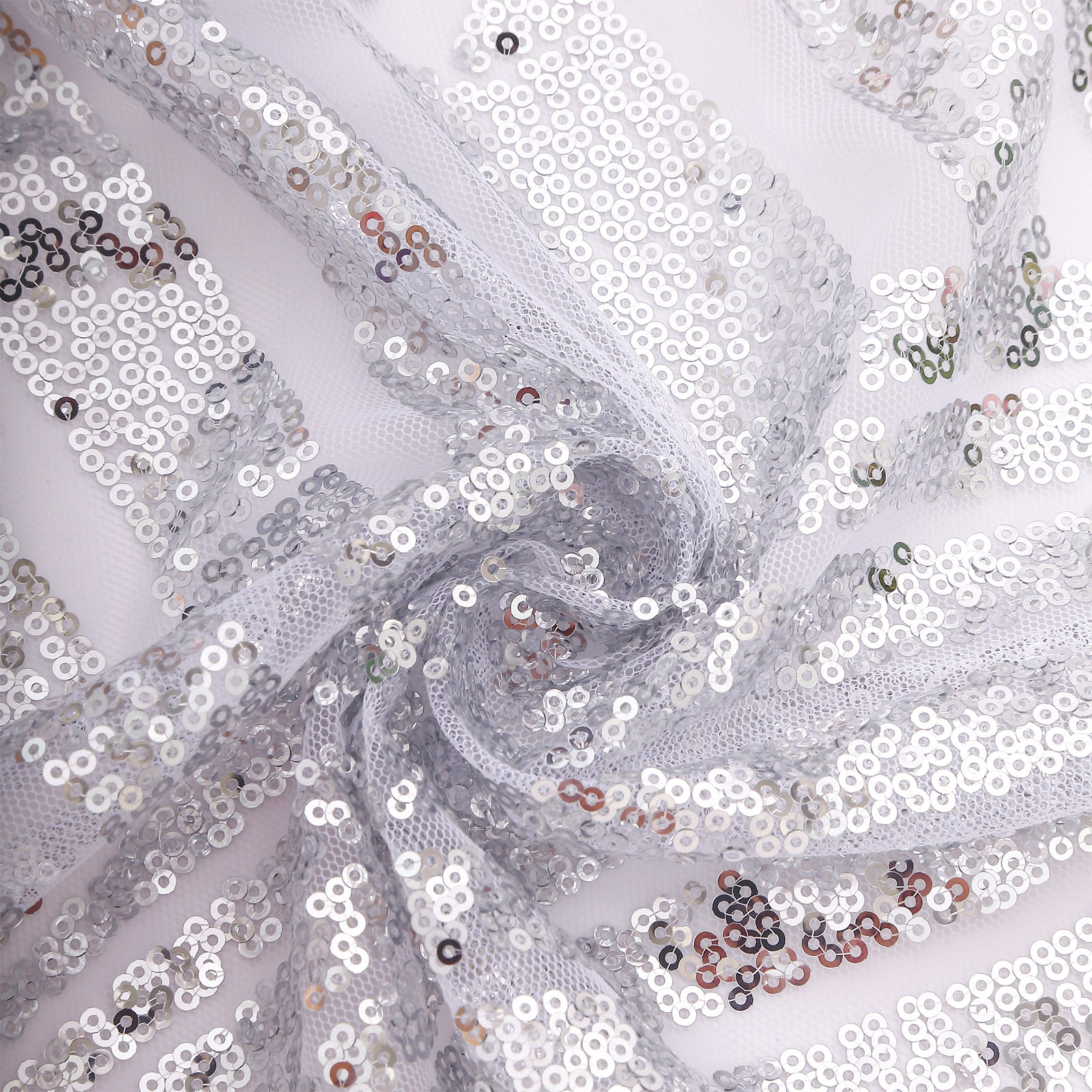 Silver geometric sequin napkins for elegant dining decor.