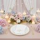 White napkin with gold foil monogram "K" on an elegant party table setting.