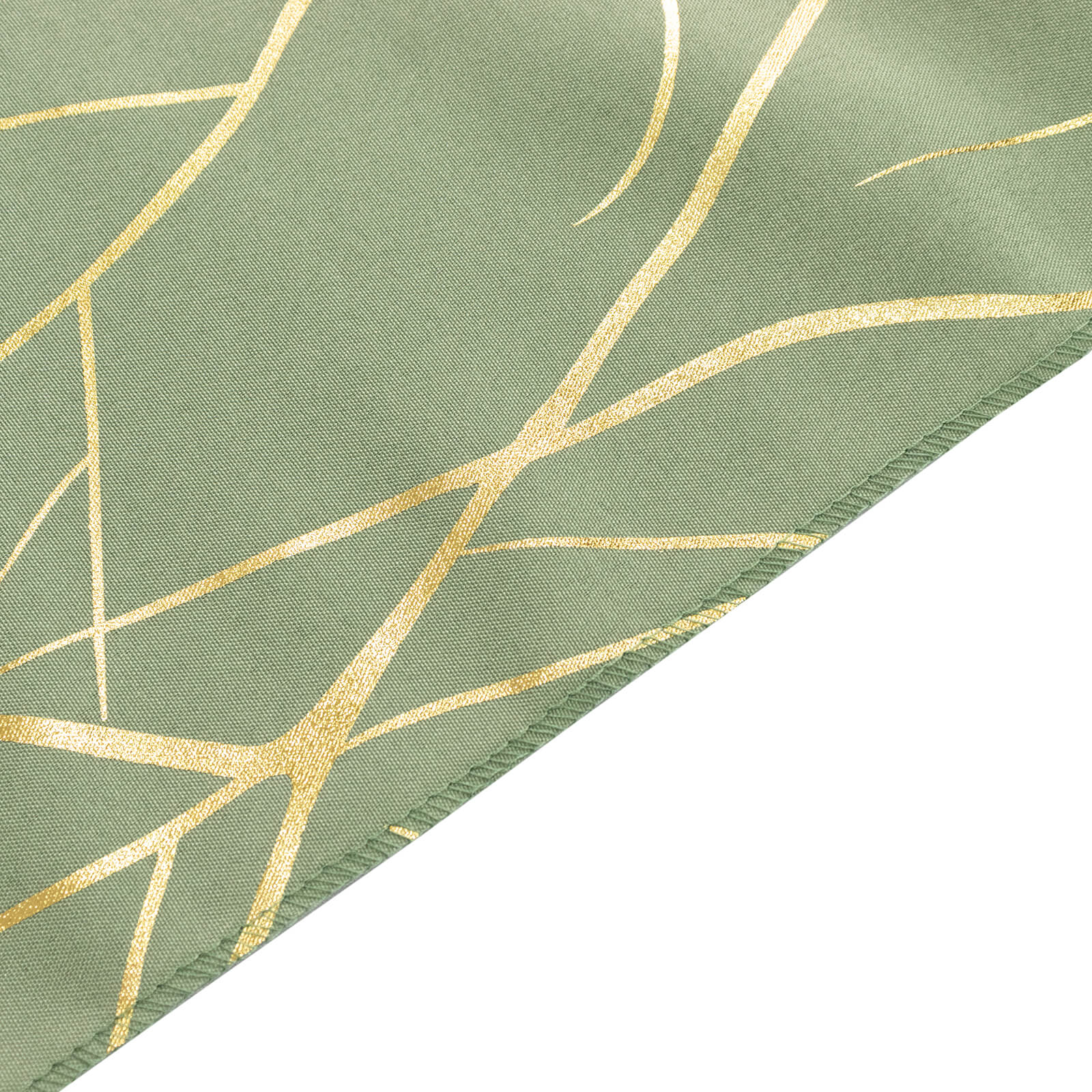 Dusty sage green napkin with gold foil tree branch pattern.