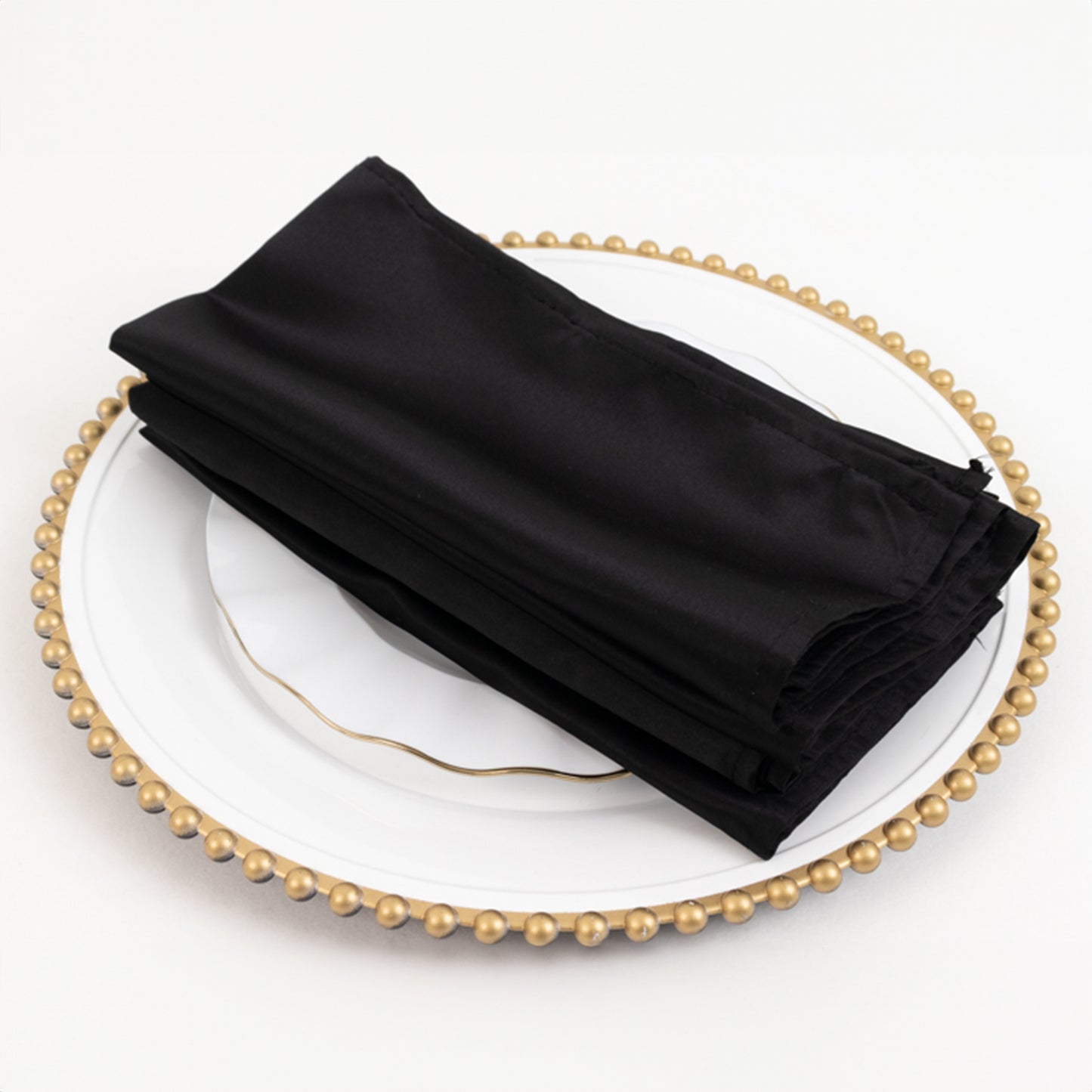 Black Lamour satin napkins, 20"x20", set of 5, elegantly displayed on a plate.
